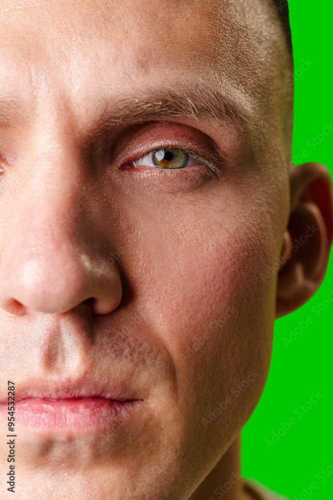 Close-Up Portrait Of A Man With Green Eyes Against A Bright Green Background Close-Up Portrait Of A Man With Green Eyes Against A Bright Green Background