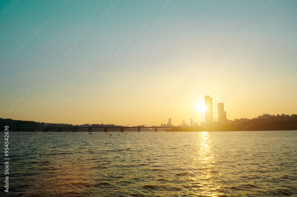 Beautiful Colorful Sunset in river. at business District in City. Beautiful Colorful Sunset in river. at business District in City.