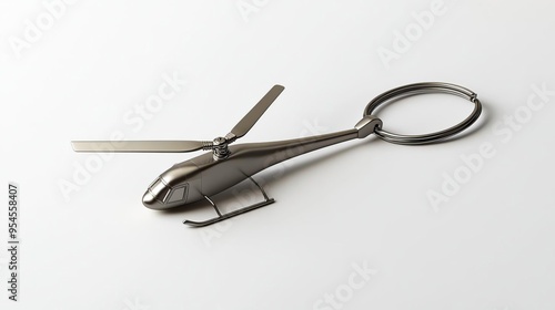 A metallic helicopter keychain, sleek and stylish, designed for holding keys.