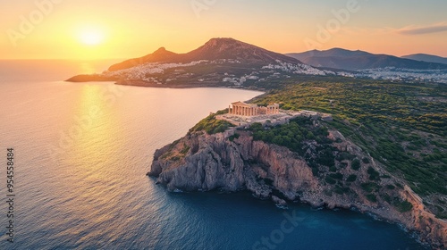 Aerial view of Sounio's Temple of Poseidon, overlooking the shimmering Aegean Sea at golden hour