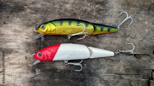 Obraz na płótnie Fishing lures set, spinning ger, angling, sport fishing, catch and release, fish bait isolated on aged wood background w salonie