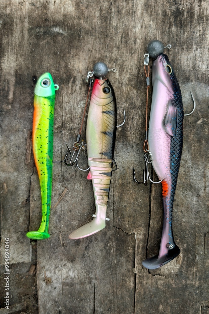 Fishing lures set, spinning ger, angling, sport fishing, catch and release, fish bait isolated on aged wood background
