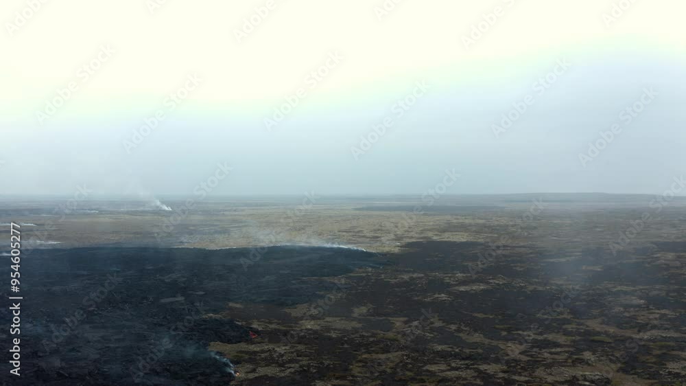 Grindavik volcano erupting in Sundhnúkur crater, Iceland, with visible fumaroles emitting steam; aerial clip moving over the volcanic landscape. Grindavik volcano erupting in Sundhnúkur crater, Iceland, with visible fumaroles emitting steam; aerial clip moving over the volcanic landscape.