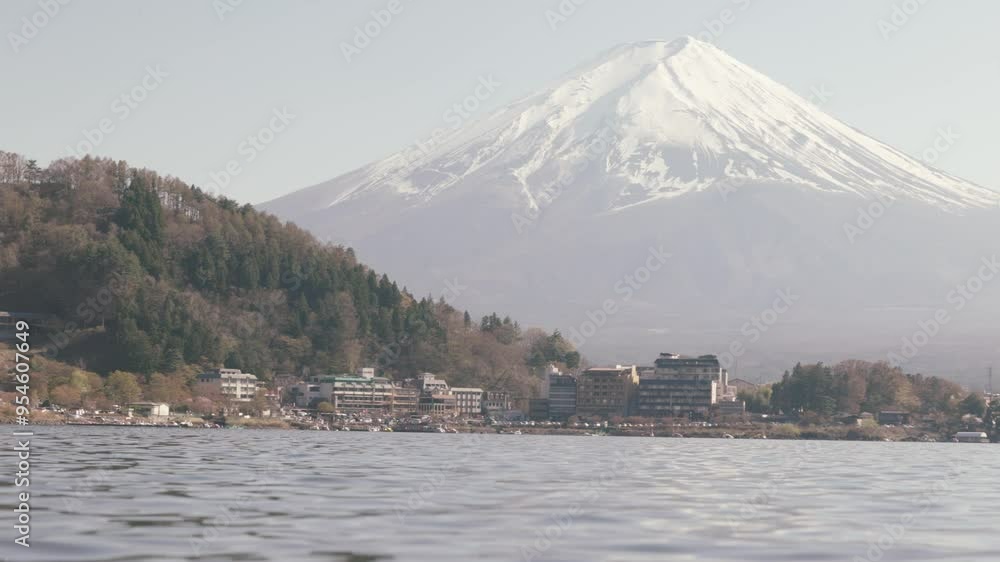 Wide shot of Lake Kawaguchiko with Mt Fuji and cherry blossoms on the right side Wide shot of Lake Kawaguchiko with Mt Fuji and cherry blossoms on the right side