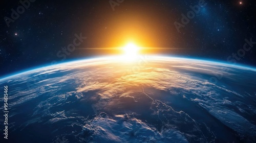 A cosmic view of Earth with the sun rising, casting a blue hue across the atmosphere.