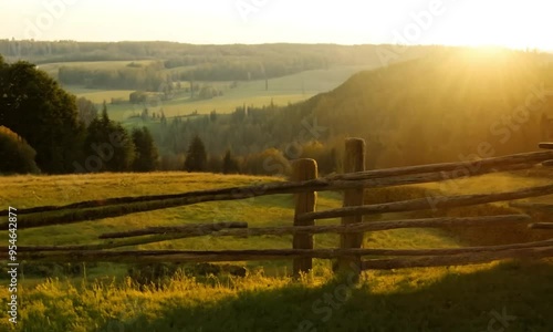 Wallpaper Mural Rustic wooden fence in a field with a bright sunset over rolling hills in the background. Torontodigital.ca