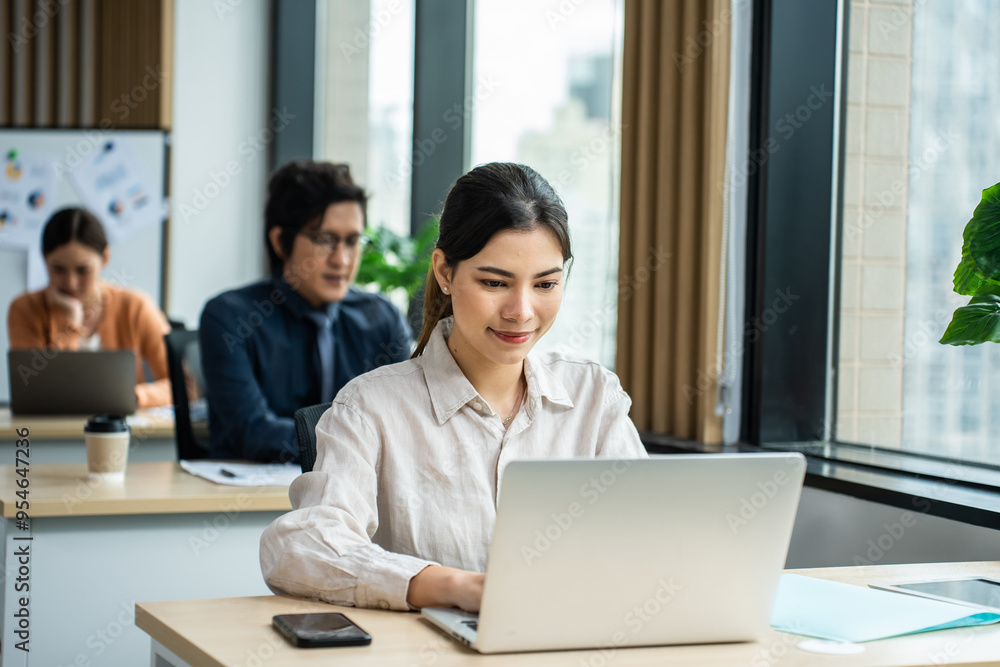 Asian beautiful businesswoman using laptop computer working in office. Asian beautiful businesswoman using laptop computer working in office.