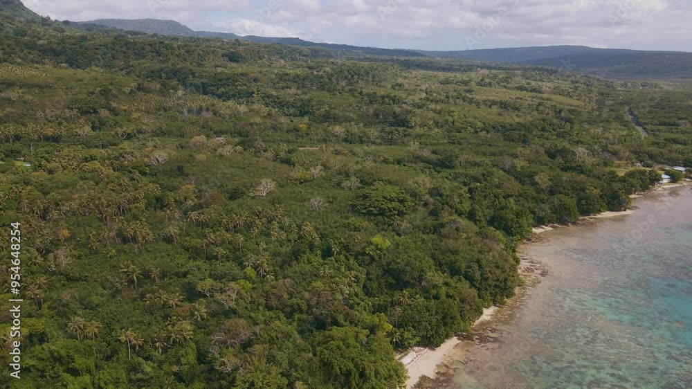 Drone aerial at Top Rock in Vanuatu moving backwards over a tropical beach with a sand island and teal water Drone aerial at Top Rock in Vanuatu moving backwards over a tropical beach with a sand island and teal water