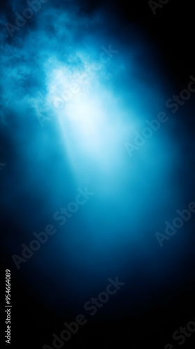 Blue and black gradient background with light shining through. photo