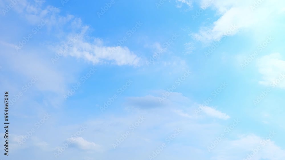 A white clouds dance gracefully across an endless azure canvas, their ethereal movements weaving a tapestry of nature's serene beauty, captured in an enchanting time-lapse. Sky background. Timelapse.
A white clouds dance gracefully across an endless azure canvas, their ethereal movements weaving a tapestry of nature's serene beauty, captured in an enchanting time-lapse. Sky background. Timelapse.