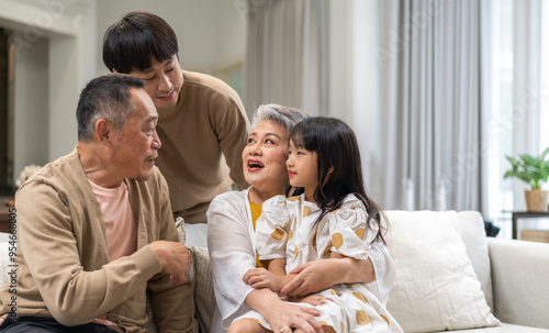 Portrait of happy love family asian father and mother playing with adorable asian kid girl.daughter, care, insurance.Happy family moments good time love with grandparents.Love of big family