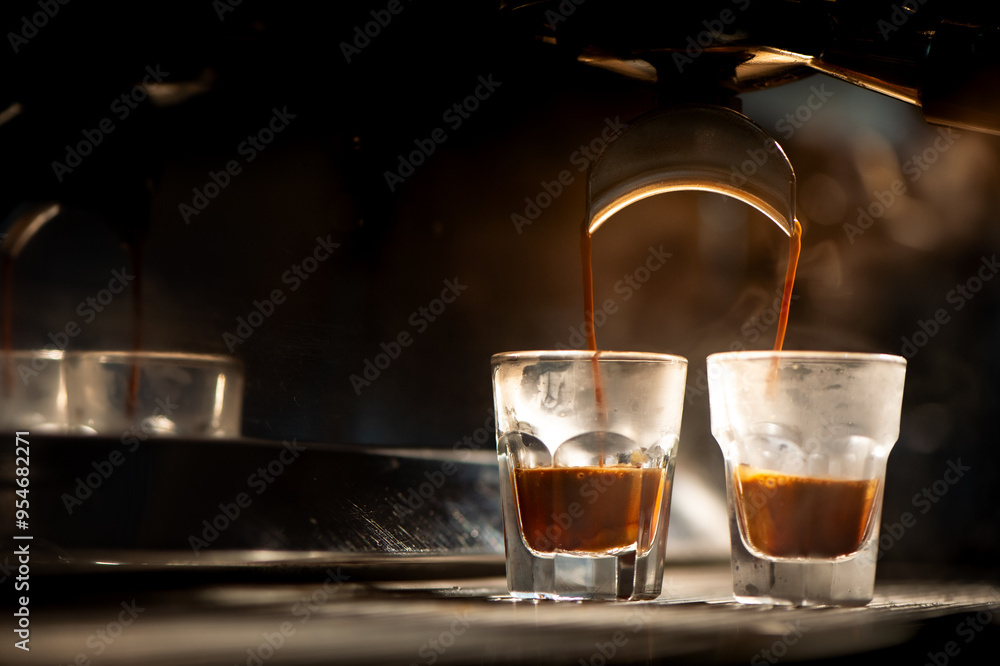 Espresso machine brewing coffee into a glass. Espresso machine brewing coffee into a glass.
