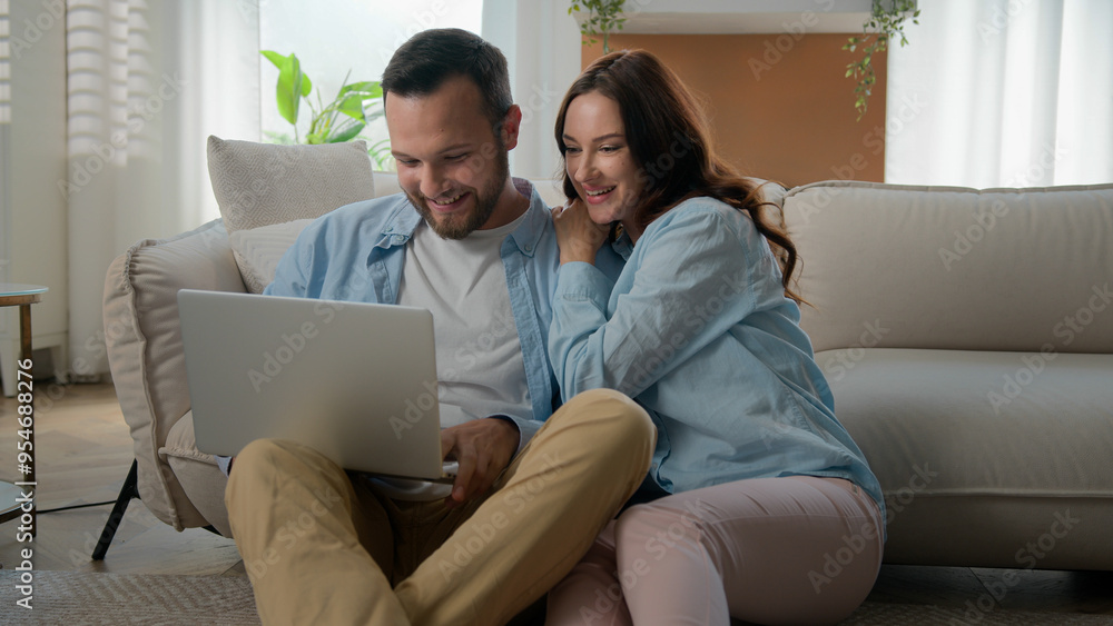 Happy family couple man Caucasian woman girlfriend boyfriend wife husband shopping online laptop using computer excited win at home internet achievement victory winning celebrating success betting Happy family couple man Caucasian woman girlfriend boyfriend wife husband shopping online laptop using computer excited win at home internet achievement victory winning celebrating success betting