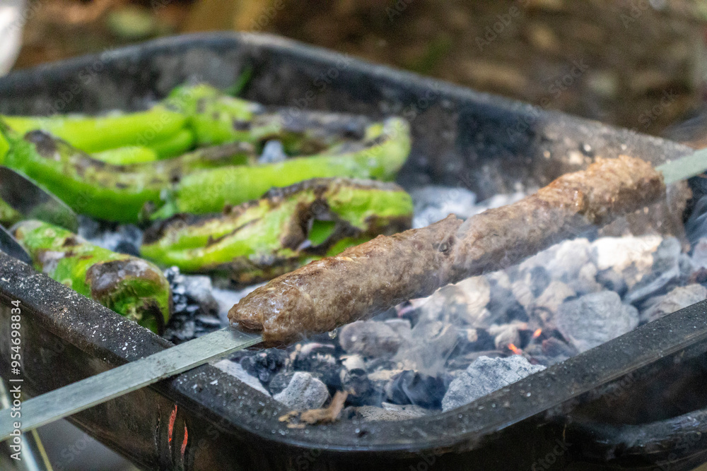 Making Turkish Adana Kebab on the barbecue Making Turkish Adana Kebab on the barbecue