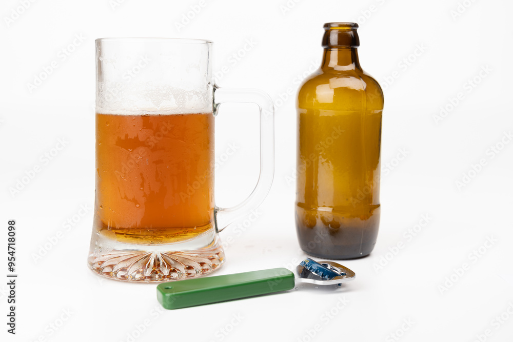 Beer Mug with Cold Beer, Empty Bottle, and Opener on White Beer Mug with Cold Beer, Empty Bottle, and Opener on White