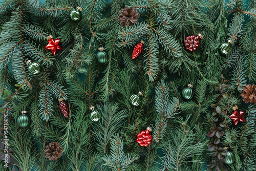 Full frame close-up of assorted Christmas conifer branches with christmas baubles for a festive background