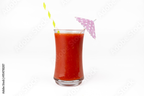 Refreshing Bloody Mary Drink with Straw and Paper Umbrella on White Backdrop photo