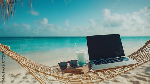 Work-from-beach setup with a laptop on a hammock overlooking the ocean a pair of sunglasses and a tropical drink are placed nearby conveying the freedom and flexibility of working from anywhere in