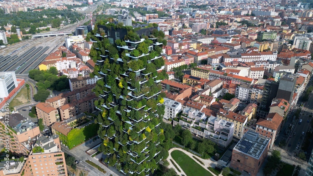 Obraz premium Italy ,Milan 09,05,2024 - Drone view of Vertical forest, bosco verticale and Unicredit tower skyscraper in Garibaldi Gae Aulenti square financial district in downtown of the city - BAM , new skyline