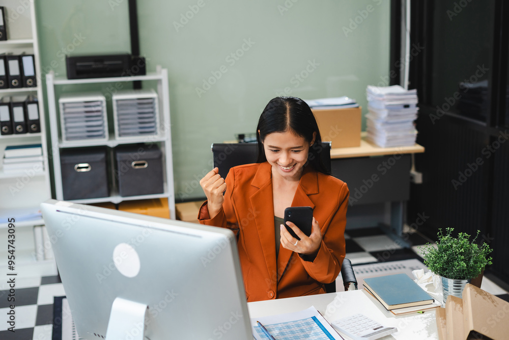 Asian business woman are excited business success with inspiration from their excellent financial results that are happy working in a modern office on a computer. Asian business woman are excited business success with inspiration from their excellent financial results that are happy working in a modern office on a computer.