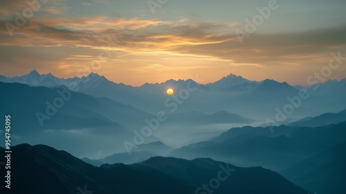 Sunrise over the misty mountain range capturing tranquil colors and silhouettes, showcasing nature's beauty at dawn