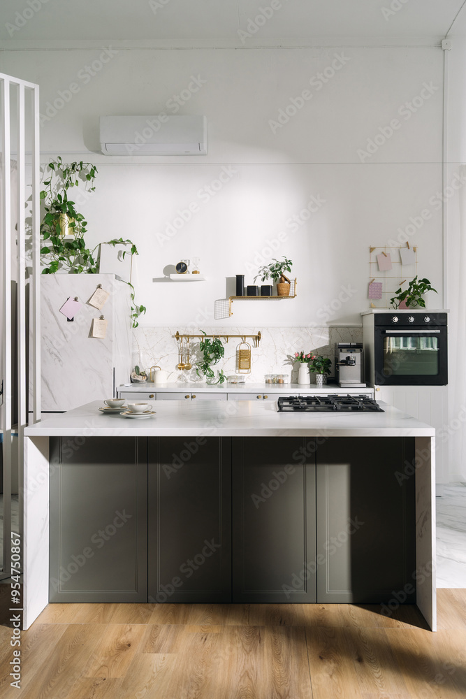 Fototapeta premium Modern kitchen with minimalist design, greenery, natural light, and sleek appliances in a bright, airy space