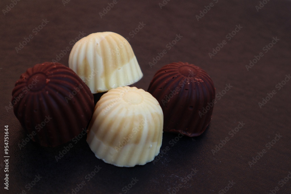 Sweet white chocolate candy and dark chocolate candy close up view. Sweet white chocolate candy and dark chocolate candy close up view.