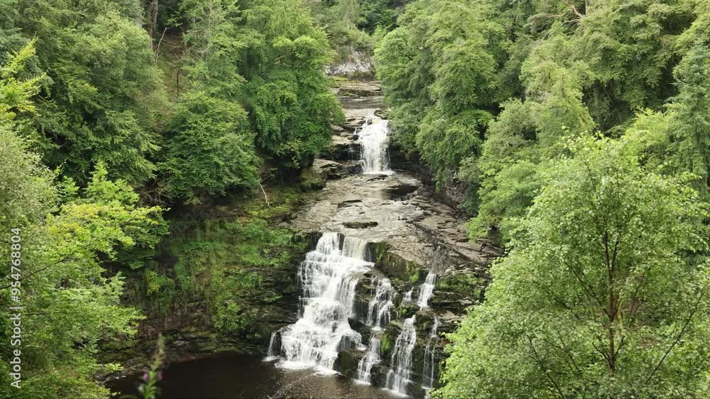 Telephoto shot of the UNESCO Falls of Clyde with green foliage
