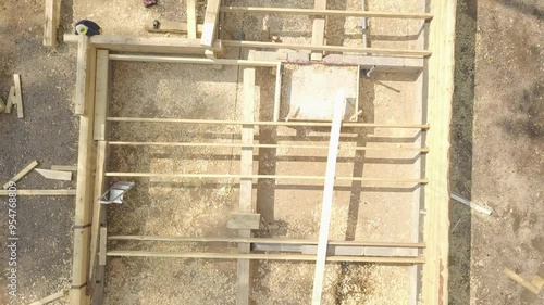 Bottom construction of a log house in the woods. photo