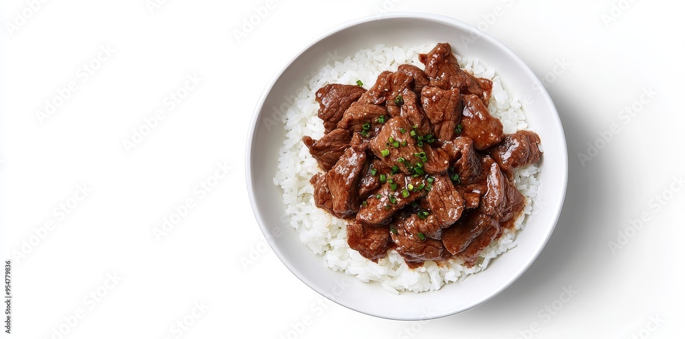 Sesame seeds and green onions on a beef and rice bowl Sesame seeds and green onions on a beef and rice bowl