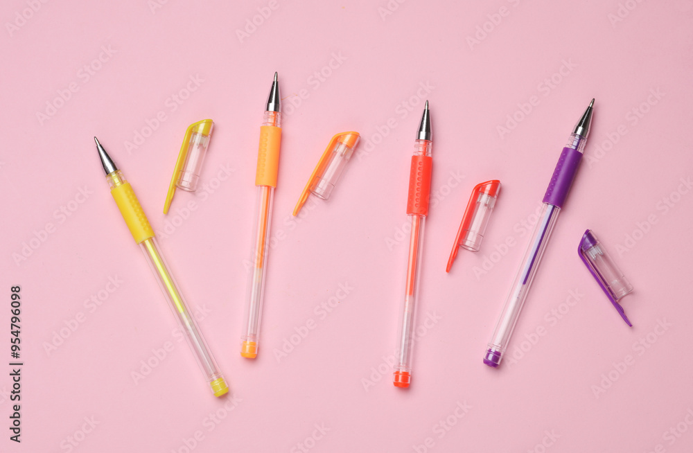 Colored pens on a pink background. Top view Colored pens on a pink background. Top view
