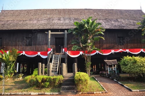 The Central Kalimantan Dayak tribe's house, called the Betang house, is made entirely of wood from the pillars to the roof. photo