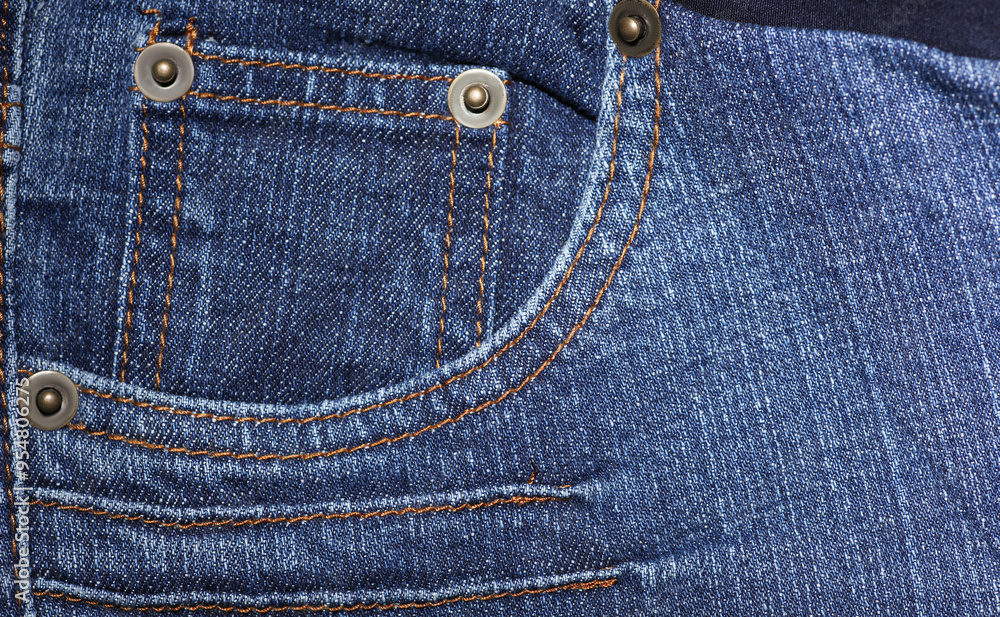 Front pocket of blue jeans pants close-up Front pocket of blue jeans pants close-up