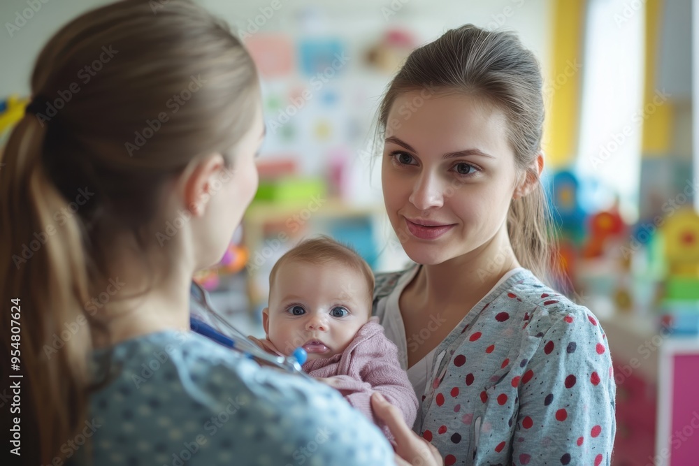 A young mother cradling her baby while talking to a pediatrician in an office. The soft colors and toys in the background convey a caring and supportive environment for families. A young mother cradling her baby while talking to a pediatrician in an office. The soft colors and toys in the background convey a caring and supportive environment for families.