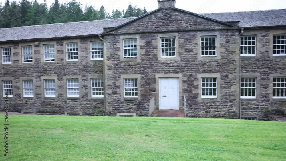 Slow panning shot of antique buildings at the UNESCO site in New lanark Slow panning shot of antique buildings at the UNESCO site in New lanark