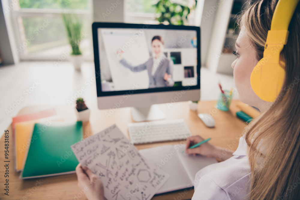 Portrait of nice young girl remote study computer screen teacher video call home indoors Portrait of nice young girl remote study computer screen teacher video call home indoors