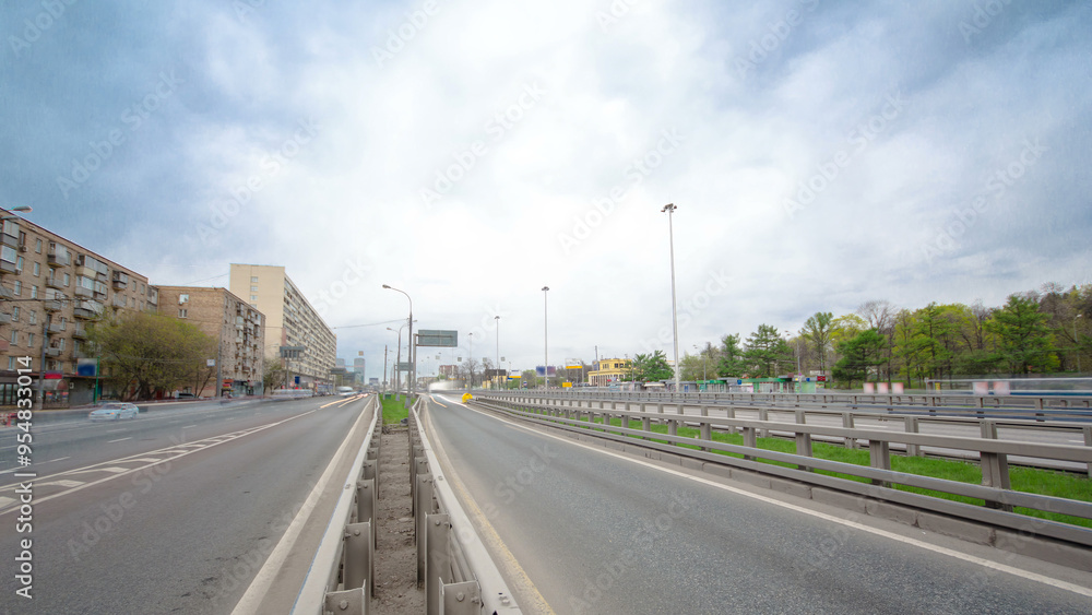 Naklejka premium Traffic jams of roadside, transportation motion in a big city. Rush hour traffic on a city roads timelapse.