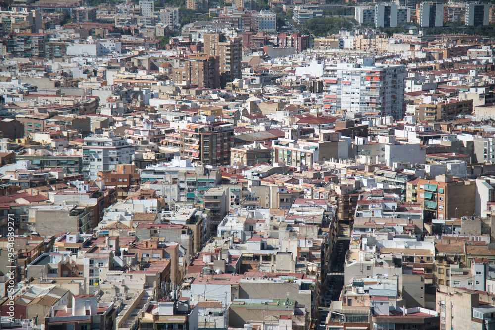 A full-frame capture of Alicante, a large city in Spain, showcasing its mix of whitewashed walls, and both high and low-rise buildings in the urban landscape.
A full-frame capture of Alicante, a large city in Spain, showcasing its mix of whitewashed walls, and both high and low-rise buildings in the urban landscape.