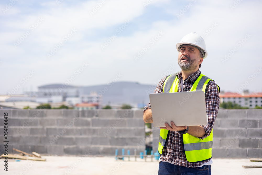 Professional Mechanical Engineer Working on Personal laptop computer at house construction site. Product quality Inspection Professional Mechanical Engineer Working on Personal laptop computer at house construction site. Product quality Inspection