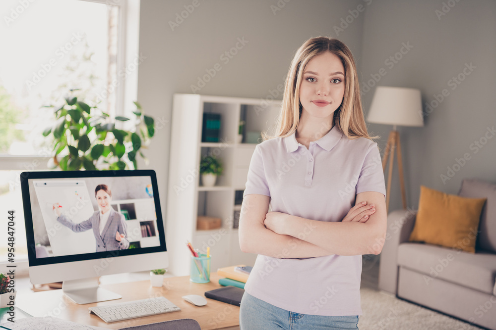 Photo of pretty cheerful lady wear violet polo arms folded distance studying modern device indoors room home house Photo of pretty cheerful lady wear violet polo arms folded distance studying modern device indoors room home house