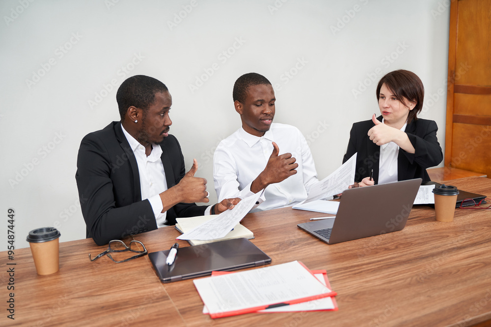 Young happy business people working together in modern office, multiethnic teamwork concept Young happy business people working together in modern office, multiethnic teamwork concept