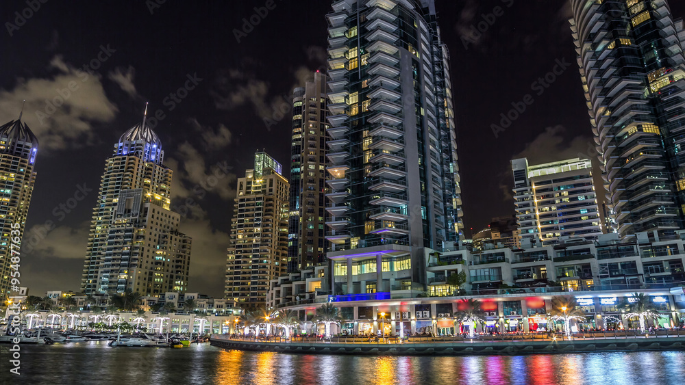 Obraz premium Dubai Marina towers and canal in Dubai night timelapse hyperlapse