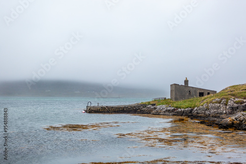 View of the Eriskay coastline, Image shows the remote Scottish islands coastline and the Atlantic ocean on a cloudy summers day  photo