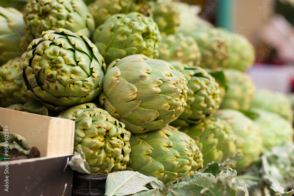 Fototapeta premium Fresh artichokes on market counter