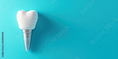 A close-up of a dental implant on a turquoise background, showcasing modern dental technology and oral health innovations.