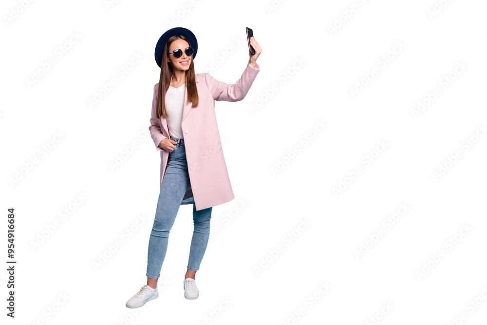 Full size photo of content lovely girl using her cell phone taking selfie wearing pink outfit denim jeans eyewear eyeglasses isolated over blue background Full size photo of content lovely girl using her cell phone taking selfie wearing pink outfit denim jeans eyewear eyeglasses isolated over blue background