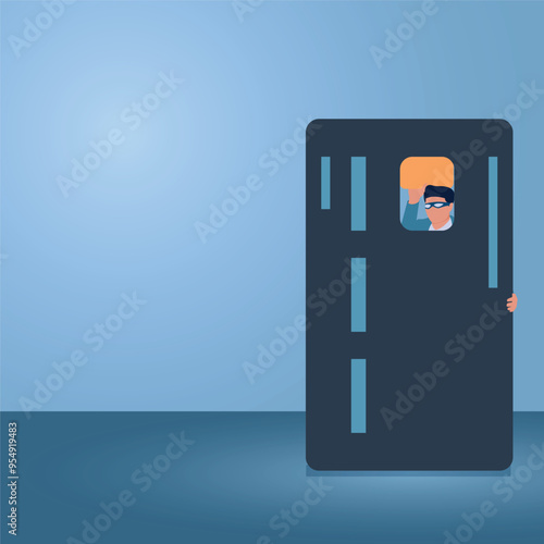 A man peeking through a credit card slot, an illustration of credit card fraud.