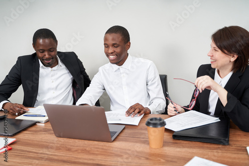 Young happy business people working together in modern office, multiethnic teamwork concept