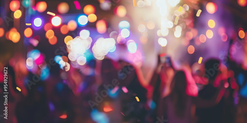 New Years event celebration, with a fireworks display creating a festive atmosphere. The blurred background explosions, bright colors, shimmering lights, fireworks sparkles. Confetti fills the air