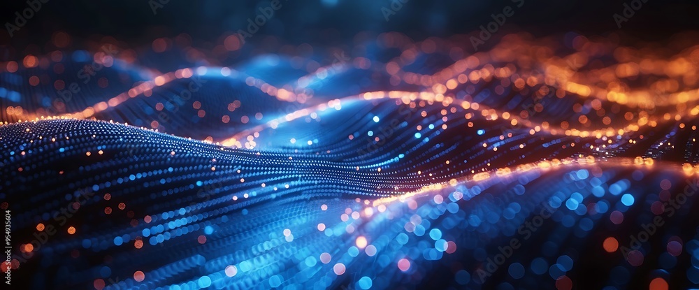 Obraz premium Abstract glowing blue and orange particles in a wavy pattern.